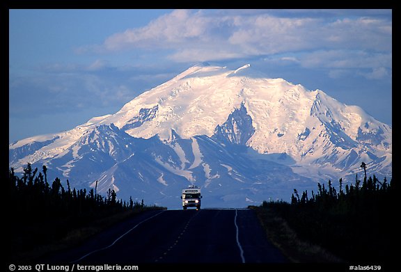 Car on Glenn Highway with Wrangell range peak behind. Alaska, USA (color)