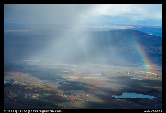 Aerial view of lakes, rainshowers, and rainbow. Alaska, USA (color)