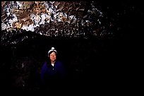 Caver inside a lava tube, Lava Beds National Monument. Lava Beds National Monument, California, USA