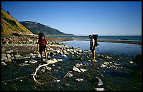 Backpackers cross a stream, Lost Coast. California, USA (color)