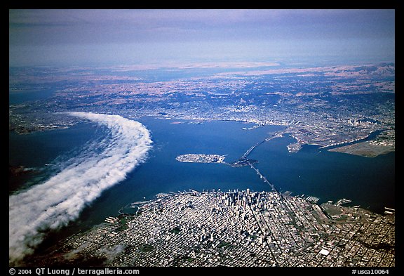 Aerial view of narrow band of fog rolling in from the Golden Gate besides the city. San Francisco, California, USA