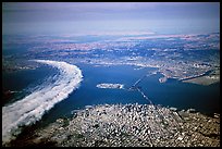 Aerial view of narrow band of fog rolling in from the Golden Gate besides the city. San Francisco, California, USA ( color)