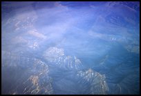 Aerial view of desert mountains with thin clouds. California, USA (color)