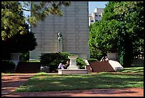 Reading at the base of the Campanile on the UC Campus. Berkeley, California, USA