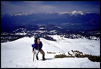Climber takes a break on the Green Ridge of Mt Shasta. California, USA (color)