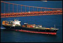 Container ship cruising under the Golden Gate Bridge. San Francisco, California, USA