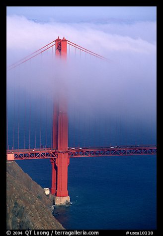 Golden Gate bridge with top covered by fog. San Francisco, California, USA (color)