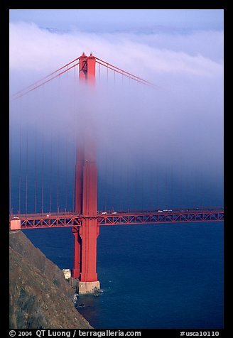 Golden Gate bridge with top covered by fog. San Francisco, California, USA