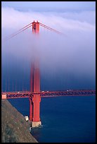 Golden Gate bridge with top covered by fog. San Francisco, California, USA