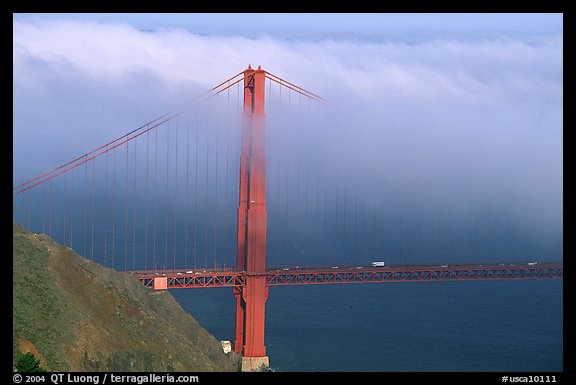 Golden Gate bridge with top covered by fog. San Francisco, California, USA (color)