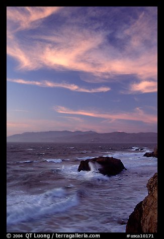 Surf and rocks at sunset seen from the Cliff House. San Francisco, California, USA (color)