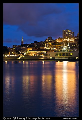 Lights of Ghirardelli Square sign reflected in Aquatic Park. San Francisco, California, USA