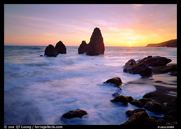 Wave action, seastacks and rocks with sun setting, Rodeo Beach. California, USA