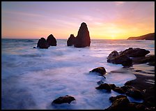 Wave action, seastacks and rocks with sun setting, Rodeo Beach. California, USA (color)