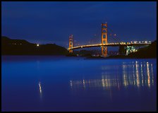 Golden Gate Bridge reflected in wet sand, blue hour. California, USA ( color)