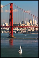 Sailboat, Golden Gate Bridge, and  city skyline, afternoon. San Francisco, California, USA (color)