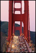 Traffic on Golden Gate Bridge at sunset. San Francisco, California, USA