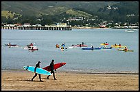 Surfers and sea kayakers, Pillar point harbor. Half Moon Bay, California, USA (color)