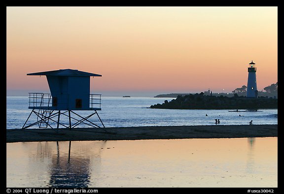 Beach cabin and lighthouse, Twin Lakes State Beach, sunset. Santa Cruz, California, USA