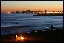 Beach campfire at sunset. Santa Cruz, California, USA (color)