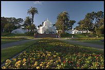 Flower bed and Conservatory of the Flowers, late afternoon, Golden Gate Park. San Francisco, California, USA ( color)