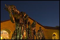 Burghers of Calais sculptures in  Quad at night. Stanford University, California, USA