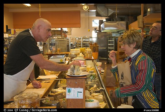 Choosing cheese at the Cheese Board. Berkeley, California, USA