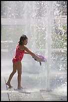 Girl refreshing herself, Cesar de Chavez Park. San Jose, California, USA