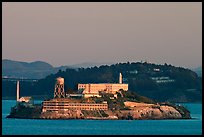 Alcatraz Island at sunset, with Yerba Buena Island in the background. San Francisco, California, USA (color)