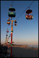 Sky glider Riders enjoy the last sunrays of the day. Santa Cruz, California, USA ( color)