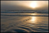 Foggy sunset over the ocean. Morro Bay, USA