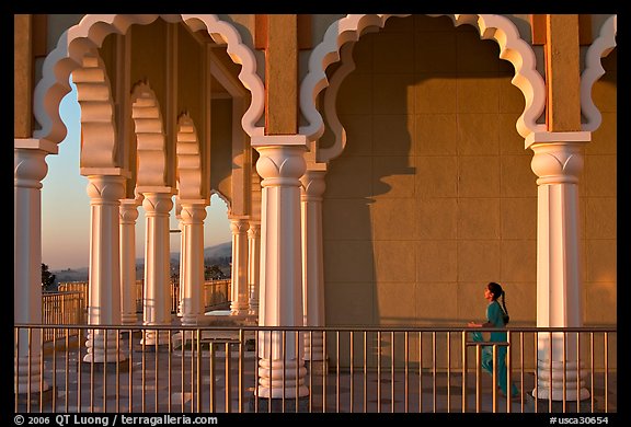 Indian girl running amongst columns of the Sikh Temple. San Jose, California, USA