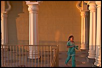 Indian girl running in the Sikh Gurdwara Temple, late afternoon. San Jose, California, USA (color)