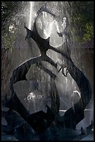 Modern fountain (The Claw) with water streaks, late afternoon. Stanford University, California, USA (color)