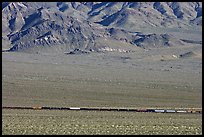 Freight train in desert valley. Mojave National Preserve, California, USA