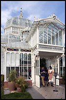 Couple exiting the Conservatory of Flowers. San Francisco, California, USA ( color)