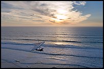 Hang glider flying  above ocean, Fort Funston, sunset. San Francisco, California, USA ( color)