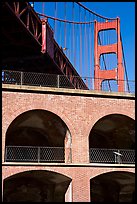 Arched galleries of Fort Point and Golden Gate Bridge pillar. San Francisco, California, USA (color)