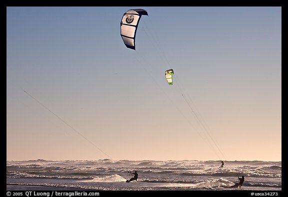 Kite surfers and Pacific Ocean waves, late afternoon. San Francisco, California, USA