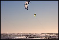 Kite surfers and Pacific Ocean waves, late afternoon. San Francisco, California, USA