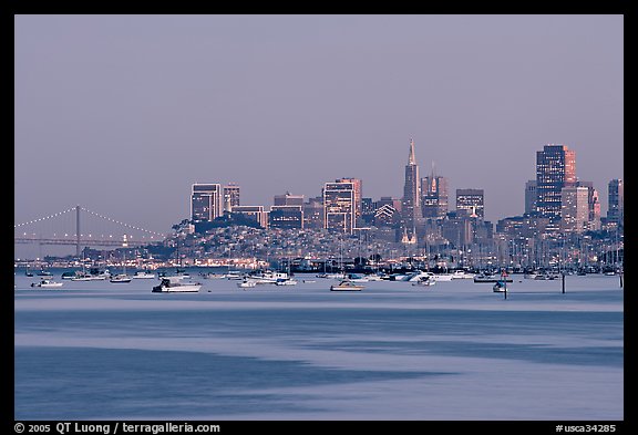Harbor in Richardson Bay with houseboats and city skyline at dusk. San Francisco, California, USA (color)