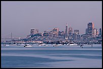 Harbor in Richardson Bay with houseboats and city skyline at dusk. San Francisco, California, USA