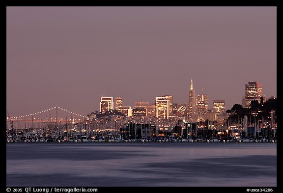 Sausalito houseboats and San Francisco skyline at night. San Francisco, California, USA