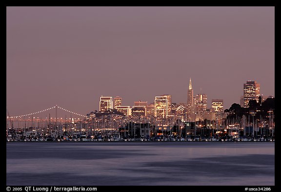Sausalito houseboats and San Francisco skyline at night. San Francisco, California, USA
