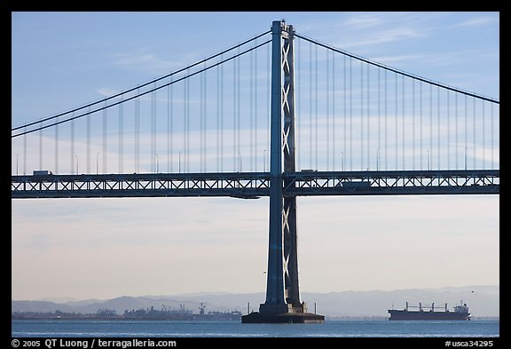 Traffic on Oakland Bay Bridge and tanker ship. San Francisco, California, USA