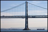 Traffic on Oakland Bay Bridge and tanker ship. San Francisco, California, USA (color)