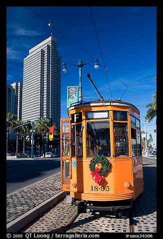 Historic trolley car and Embarcadero center building. San Francisco, California, USA