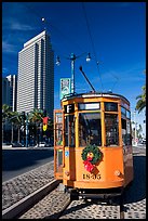 Historic trolley car and Embarcadero center building. San Francisco, California, USA