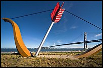 Modern sculputure called Cupid's arrow, framing the Bay Bridge. San Francisco, California, USA