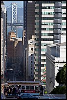 Cable-car, Chinatown, Financial District and Bay Bridge. San Francisco, California, USA (color)